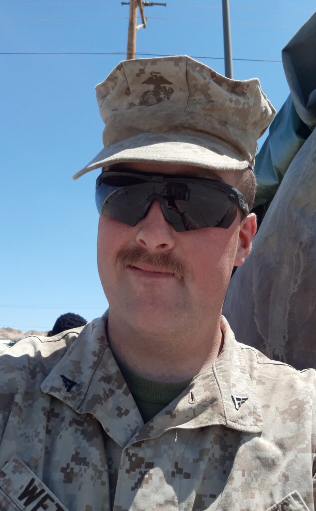 Dean Wetzel picture of himself wearing his Marine Corps cap and sunglass.